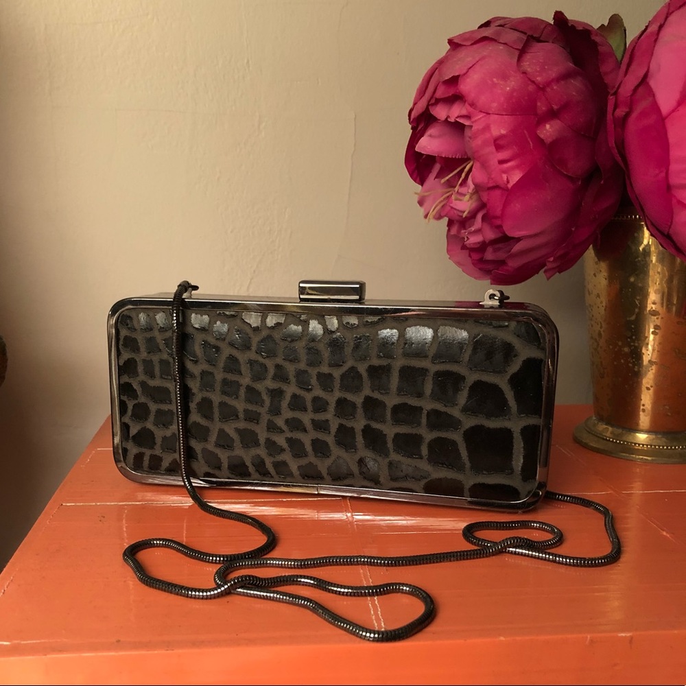 BCBG clutch with crocodile pattern